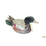 A painted wooden decoy duck