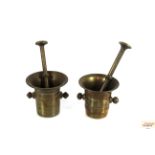 A pair of brass pestles and porters