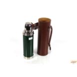 A vintage Isovac Thermos flask in leather travelli