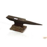 A small cast iron bench top anvil, 15" long