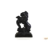 A Victorian cast iron lion door stop