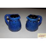 A pair of Branham pottery puzzle jugs