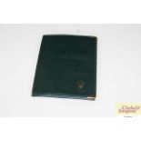 A Rolex green passport wallet, stamped to the inte