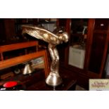 A large Spirit of Ecstasy figure raised on circula