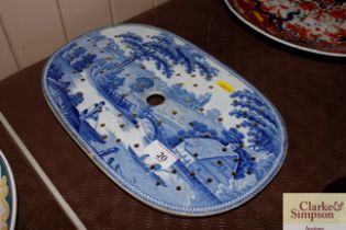 An early 19th Century Staffordshire strainer printed with country house etc.