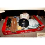 A box containing various decorative china to inclu