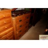 A Victorian stripped pine chest of two short and t