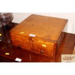 An oak table top chest fitted two drawers