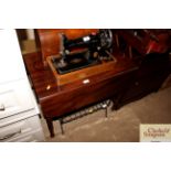 A 19th Century mahogany Pembroke table raised on r