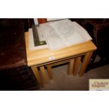 A nest of three beech occasional tables