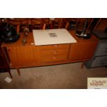 A Schreiber teak effect sideboard fitted three cen