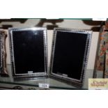 A pair of silver mounted easel photograph frames