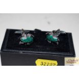 A pair of frog cuff-links