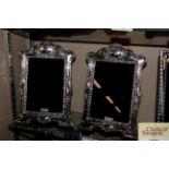A pair of silver mounted easel photograph frames