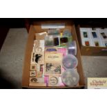 A box containing various card making items, rubber