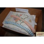 A box containing 1960's embroidered linen and hand