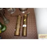 Two large brass spice and pepper mills with hinged