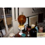 A Veritas Lampworks Art Deco oil lamp with amber g