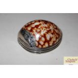 A Cowrie shell and white metal mounted snuff