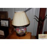 An Oriental table lamp and shade