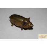 A Victorian brass pig vesta with hinged lid