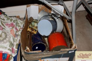 A box containing various vintage tins, fire iron,