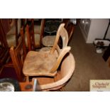 A wicker armchair; and a n elm seated bar back cha