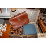A vintage leather suitcase and contents of a groom