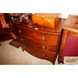 A 19th Century bow front chest fitted three long d