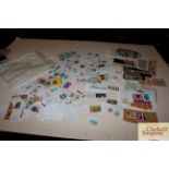 A large packet of various loose French stamps on a