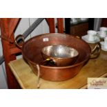 A copper and brass preserve pan and a colander