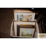 A box containing various pictures and prints to in