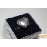 A boxed 925 beaten heart shaped ring