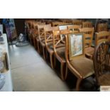 A set of eight reproduction yew wood dining chairs