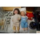 Two German dolls with cushions