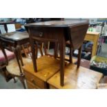 A mahogany drop leaf occasional table