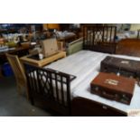 A Heals single mahogany bedframe with mattress