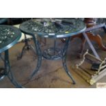 An ornate metal garden table