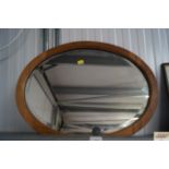 A oval bevel edged wall mirror