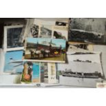 A box containing various postcards