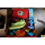 A box containing various marble run and various ot