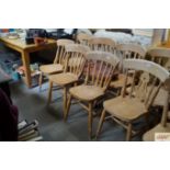 A set of six slat back chairs