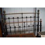 A Victorian brass and iron bedframe