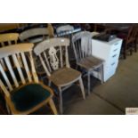 Two stick back dining chairs together with two spi