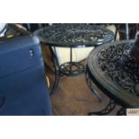 An ornate metal garden table