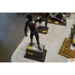 A bronze athlete figure