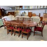 A reproduction mahogany oval dining table and eigh