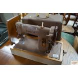 A Singer sewing machine in fitted case