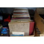 A box containing various records