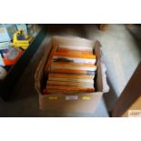 A box containing Penguin books